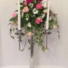 wedding flowers candelabra arrangement pinks trailing ivy silver candlestic