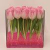 wedding venue table flower display pink tulips in large glass vase tank