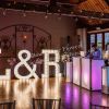 l & r The five arrows hotel waddesdon dairy venue pedestals and tall flower