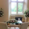 Notley Abbey wedding venue ceremony registrar table flower and pedestal arr