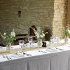 Tythe Barn Launton Jam Jars and rosemary and rose place settings